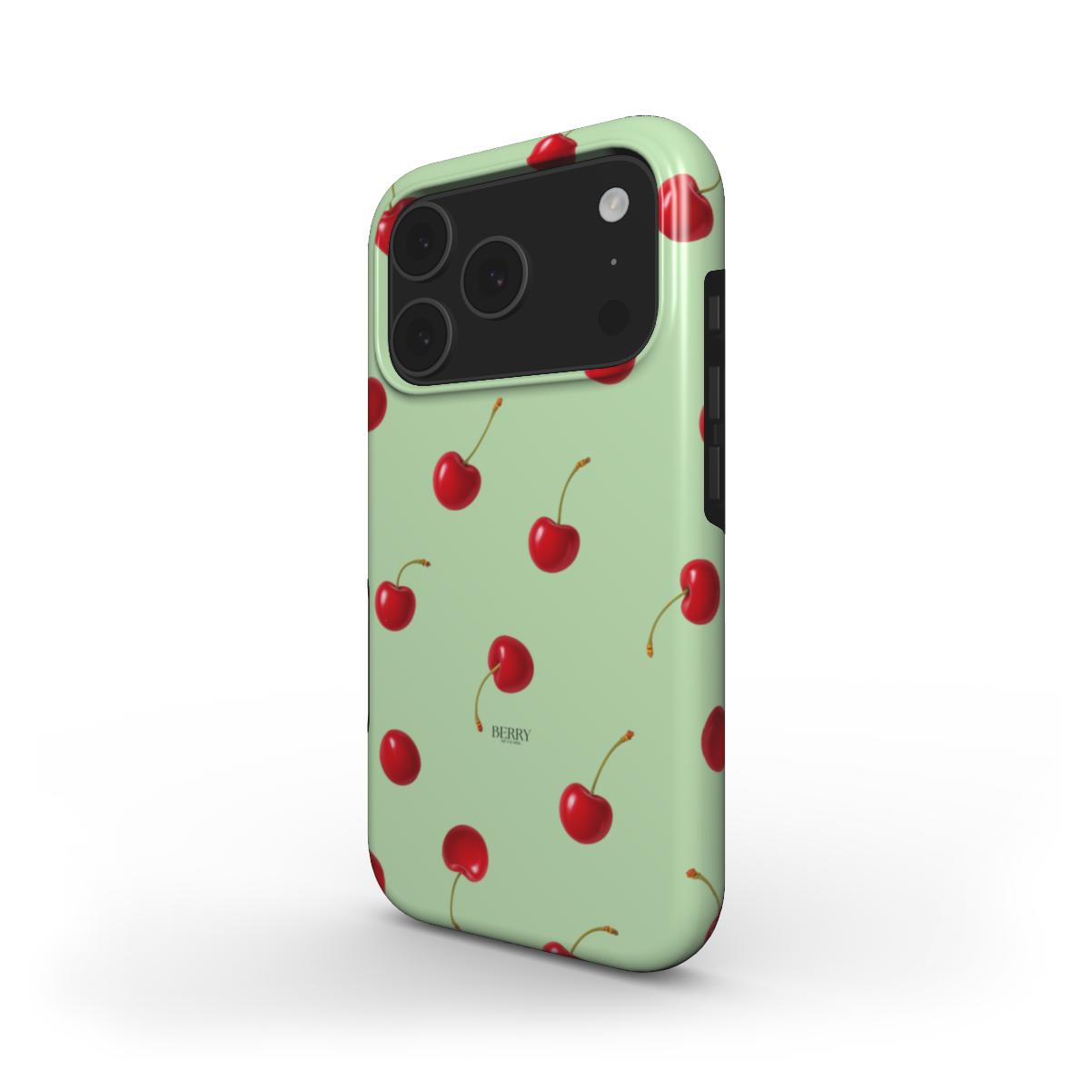 Trendy phone case with a feminine cherry pattern on a soft green background, combining girly charm and a popular aesthetic for that girl style.