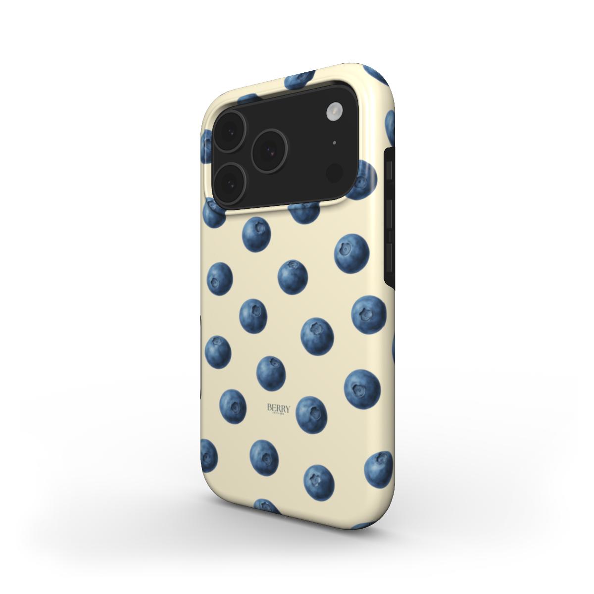 Trendy phone case featuring a playful blue and yellow multicolored pattern of blueberries on a soft cream background for a feminine and aesthetic look.