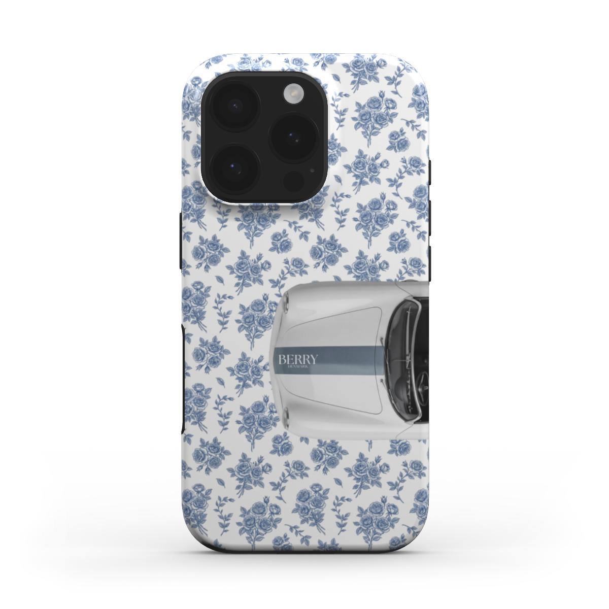 Trendy feminine phone case with blue floral pattern and stylish white vintage car design, blending girly charm with a beautiful aesthetic look.