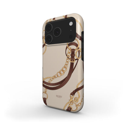 Trendy feminine phone case with beige background featuring gold and brown equestrian-inspired chains and straps for a beautiful, aesthetic look.