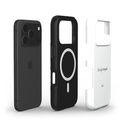 Black smartphone with two phone cases, one black with circular MagSafe design and one white with "Do it for the plot" text, showcasing a trendy feminine accessory style.
