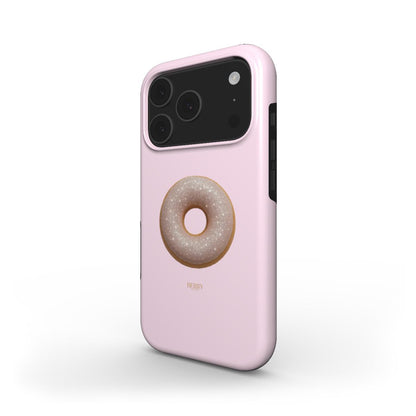 Trendy pink phone case featuring a glittery beige donut design with feminine and girly aesthetic in gold and multicolored accents.