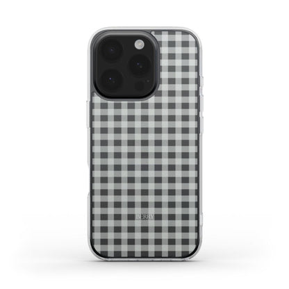 Clear and classy phone case with a trendy black and white checkered pattern, combining feminine charm and modern style for a beautiful look.