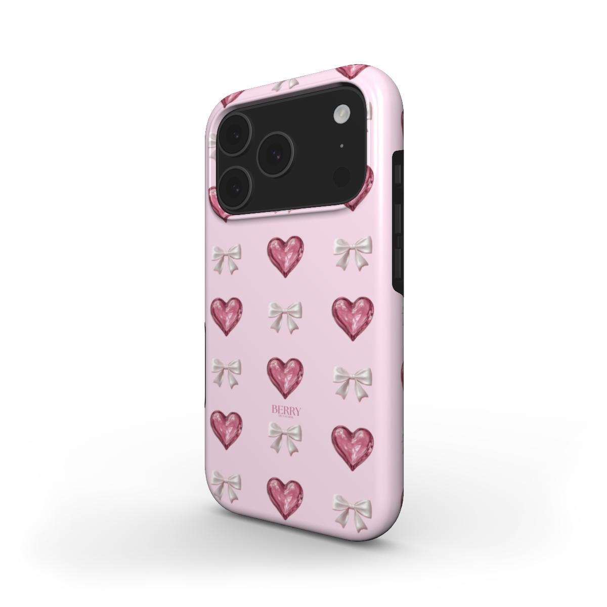 Pink phone case with glass-like hearts and white bows in a colorful pattern, combining trendy and feminine charm for a stylish look.