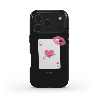 Trendy black phone case with a pink ace of hearts card design, featuring a lipstick kiss mark for a girly and feminine aesthetic.