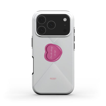 Trendy feminine phone case with a clear design and a pink heart-shaped pop socket featuring delicate cursive text, perfect for a stylish, girly look.