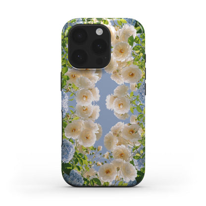 Trendy phone case with white, blue, beige, and multicolored floral pattern inspired by spring, offering a feminine and beautiful aesthetic.