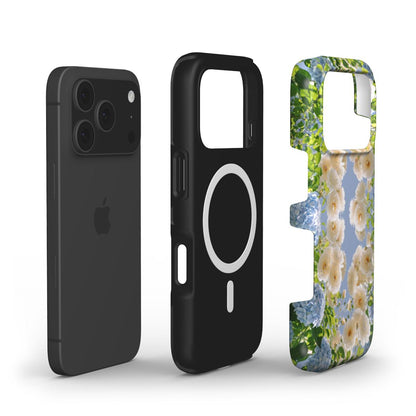 Trendy feminine phone case with colorful floral pattern in white, blue, beige tones, designed to fit securely and stylishly with advanced magnetic technology.