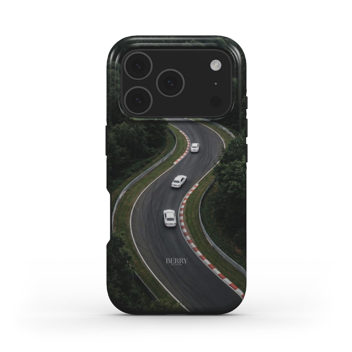 Trendy phone case with a green and black winding road design featuring white cars, blending feminine style with a sleek, popular aesthetic.