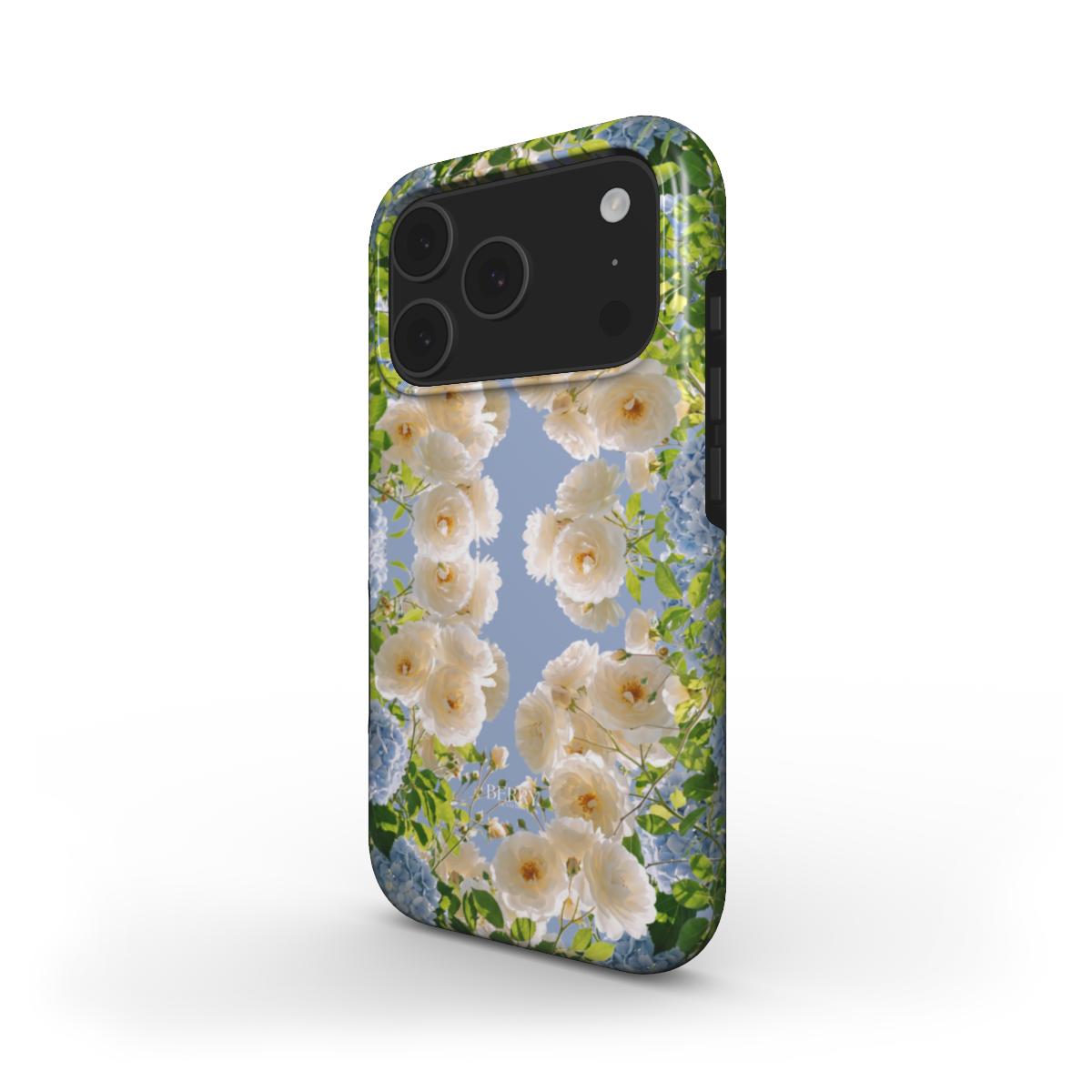 Trendy feminine phone case with multicolored floral pattern in white, blue, and beige tones, evoking a beautiful spring aesthetic.