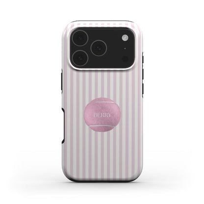 Trendy feminine phone case with pink and white stripes, featuring a stylish pink tennis ball design for a popular girly aesthetic.