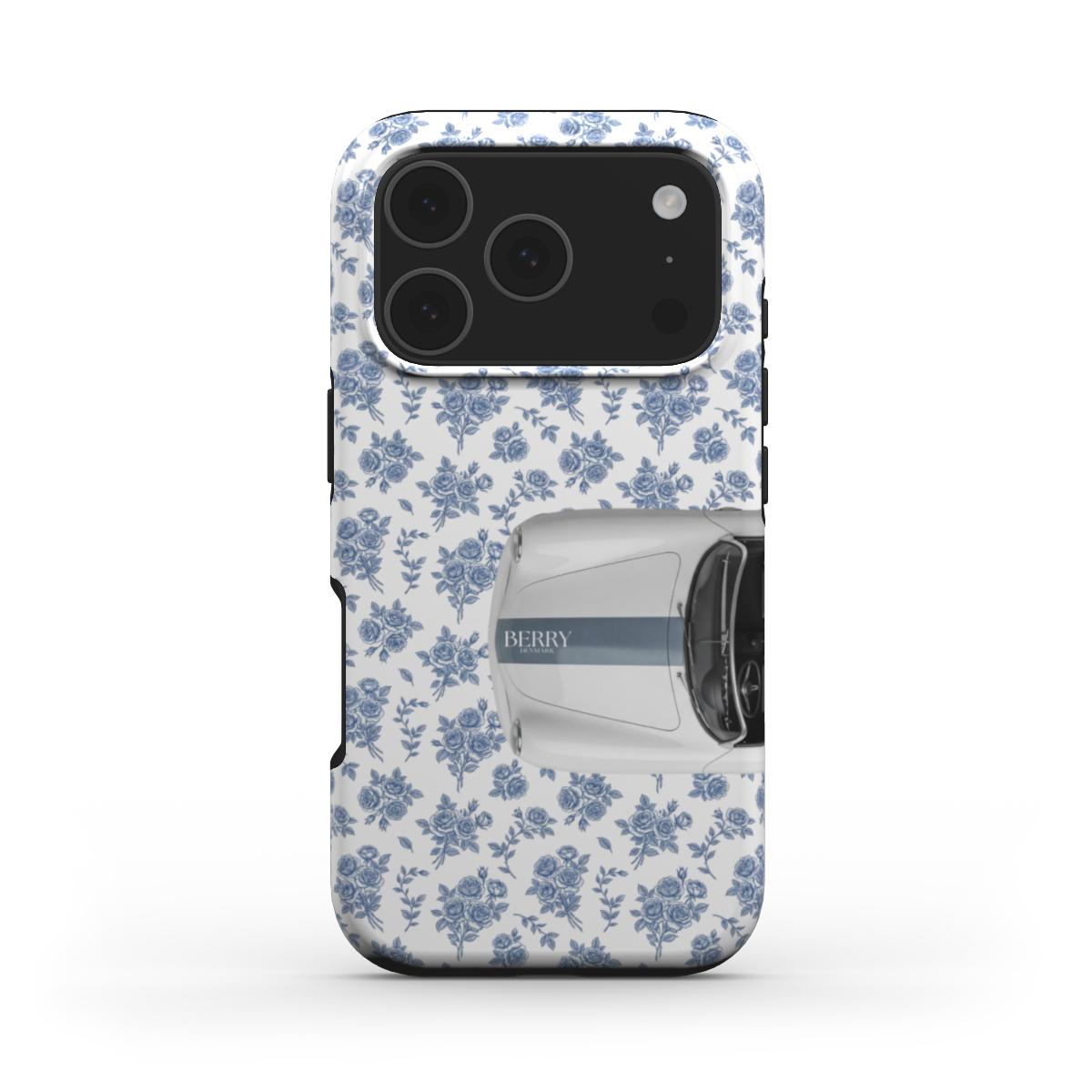 Trendy phone case with a feminine white background, blue floral pattern, and a stylish vintage car design for a chic, aesthetic look.